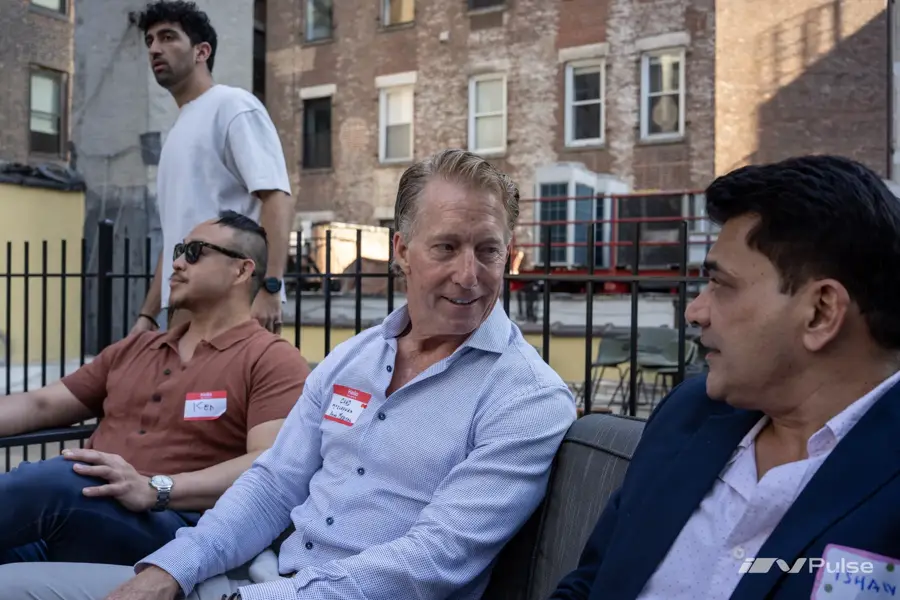 Guests on a rooftop terrace at an InPulse event